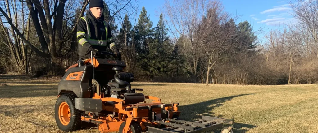 Professional providing lawn care basics with commercial mower in Middleton, WI