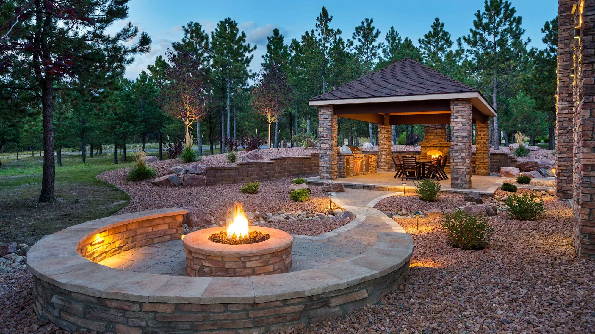 outdoor patio with modern fireplace at dusk