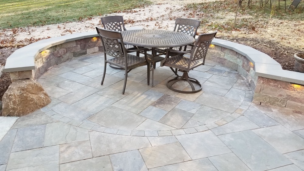 Beautiful stone pathway winding through a luxury landscaped garden