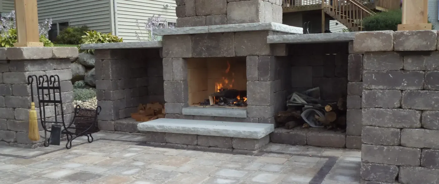 modern fire pit landscape design trends with contemporary patio and seating by Carrington Lawn & Landscape in Middleton, WI