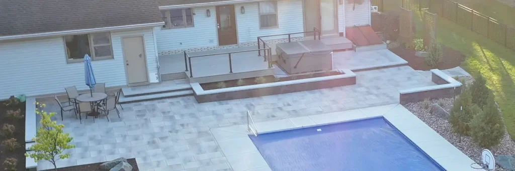 Modern pool and patio design showcasing expert patio designer vs contractor work by Carrington Lawn & Construction in Middleton, WI