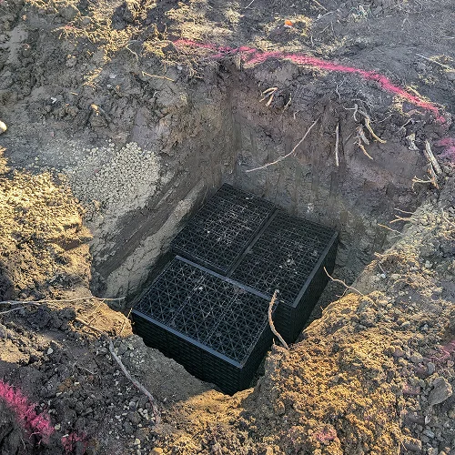 Dry creek bed drainage system in Madison WI installed by Carrington Lawn & Landscape to prevent erosion