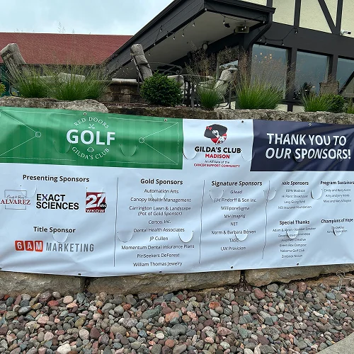 Sponsorship banner for Gilda’s Club Madison featuring Carrington Lawn & Landscape supporting local community involvement in WI