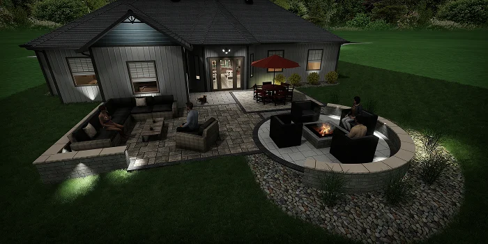 Backyard patio with night lighting, fire pit, and seating area showing landscape design cost by Carrington Lawn & Landscape in WI