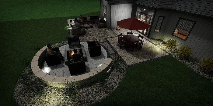 Nighttime view of modern fire pit area with lighting and patio seating showing landscape design cost by Carrington Lawn & Landscape in WI