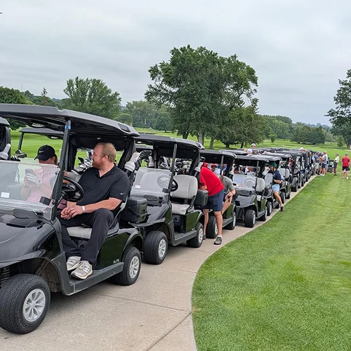 Golfers and volunteers preparing for the Red Doors Golf Outing — an event showcasing Madison community involvement supported by Carrington Lawn & Landscape in WI