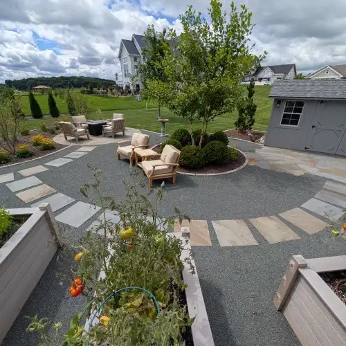 Functional backyard with bluestone patio landscape design by Carrington Lawn in Middleton WI