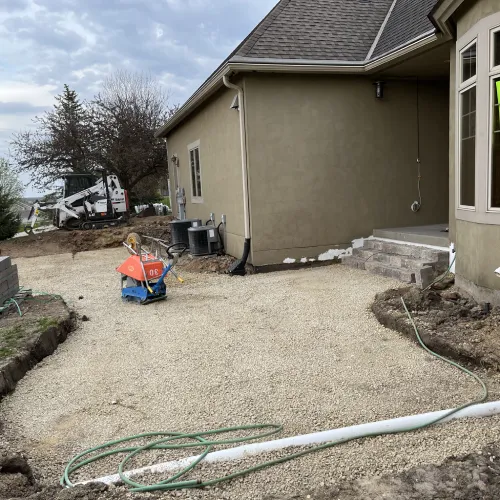Excavation and gravel base preparation for a new patio showcasing thoughtful craftsmanship by Carrington Lawn & Landscape | Madison in WI