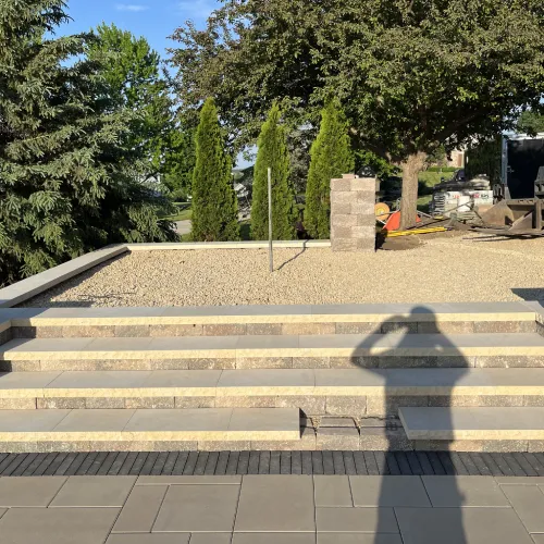 Newly installed stone landscape steps and gravel landing designed for long-term durability by Carrington Lawn & Landscape | Madison in WI