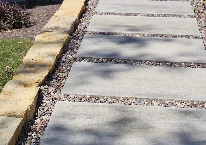A walkway made of large, flat stones with small pebbles filling the gaps in Middleton, WI