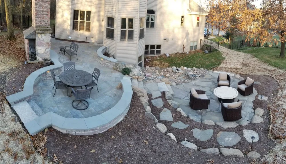 Luxury patio design with a custom fire pit and comfortable seating