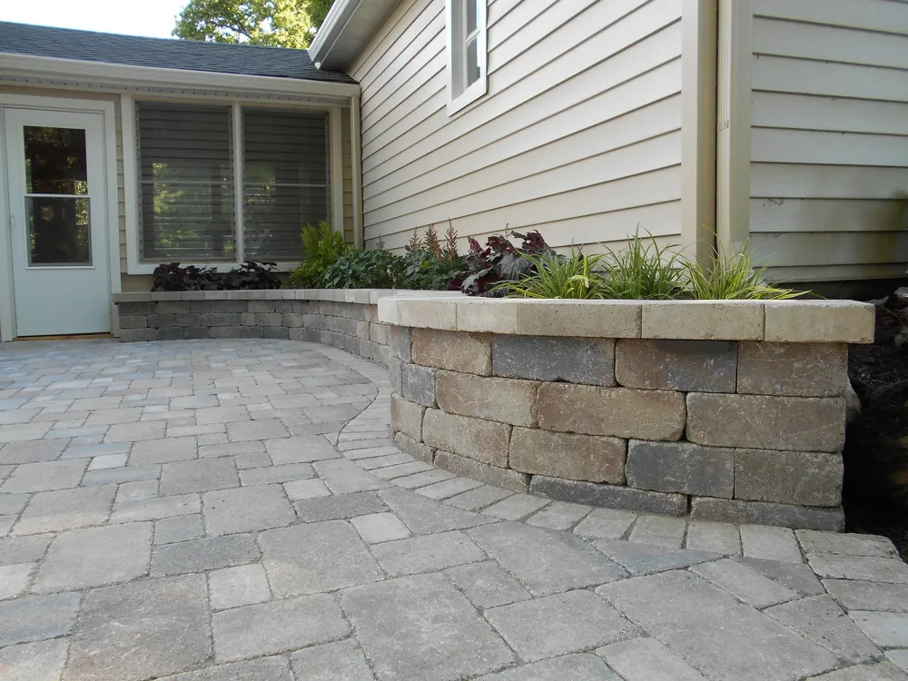 Stone pathway winding through a luxury landscaped garden