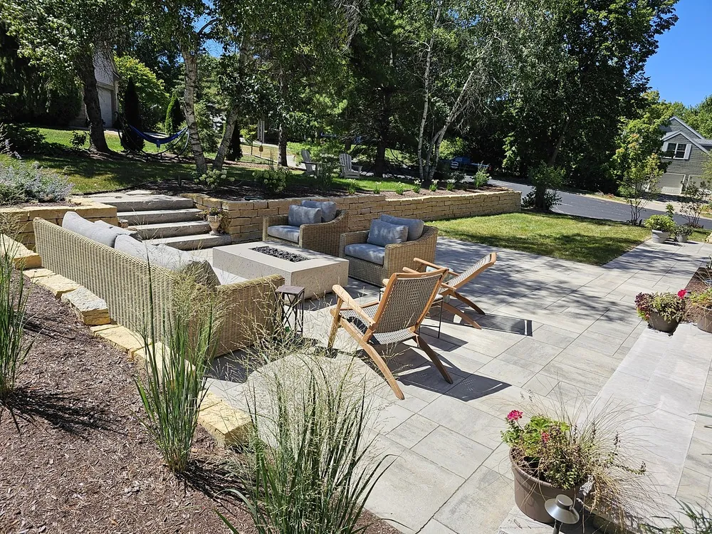 Outdoor living space with fire pit and lounge furniture