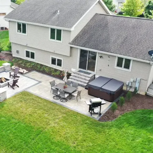Custom paver patio and fire pit outdoor living space in Madison WI by Carrington Lawn & Landscape